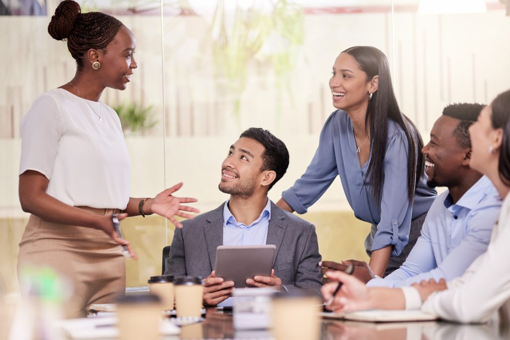 Shot of a group of coworkers using a digital tablet during a business meeting